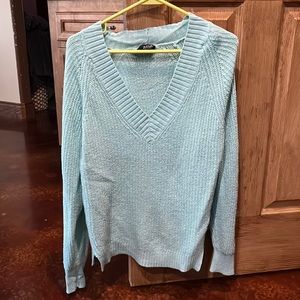 Loose knitted turquoise sweater